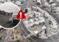 Aerial view of a curved road with a white car crashed into a wall, shown in a circular inset with a red warning icon overlaying the scene.