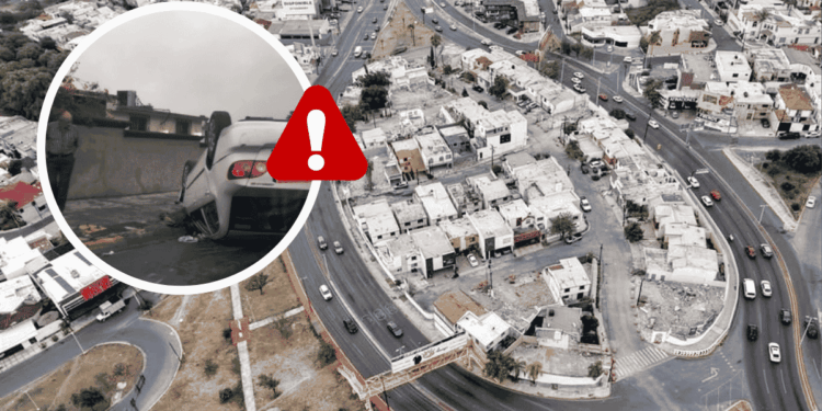Aerial view of a curved road with a white car crashed into a wall, shown in a circular inset with a red warning icon overlaying the scene.